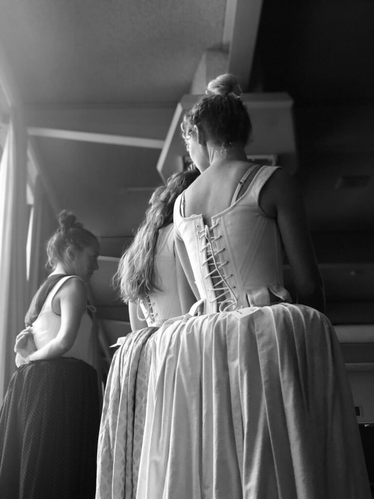 actors wearing practice corsets and skirts for Jacobean theatre